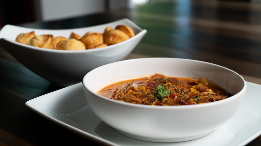A bowl of Brunswick stew seasoned with sofrito and adobo